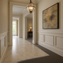 Grey PVC floor transition strip in luxury UK entrance hall between marble tile and carpet