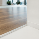 Aluminium LVT edge trim installed at commercial office floor edge - professional finish