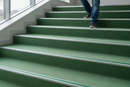 Heavy duty carpet stair nosing with Green insert — installed on UK carpeted staircase, anti-slip protection over carpet