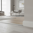 LVT U-edging profile installed at edge of luxury vinyl tile floor in modern UK living room