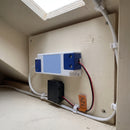 12V LED driver and six-port distribution block mounted on a board in an under-stairs service void, leads running to the stair lighting