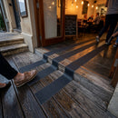 Black anti-slip safety grip tape roll, 100mm wide, with textured aluminium oxide surface for indoor outdoor use