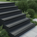 Black PVC stair nosing on dark composite decking steps in modern British garden