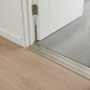 35mm flat aluminium door threshold strip installed in UK home hallway between laminate and carpet flooring