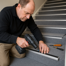 Landlord installing heavy duty carpet stair nosing on rental property carpeted staircase - screw fix retrofit installation