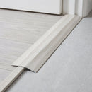 White Oak wood effect threshold ramp fitted in a doorway bridging laminate and vinyl flooring