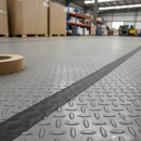 Conformable aluminium foil anti-slip tape on diamond plate metal floor — foil backing conforms to raised pattern