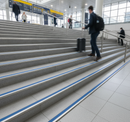 DDA anti-slip stair nosing with Blue PVC insert — installed on UK public building staircase, Part M compliant