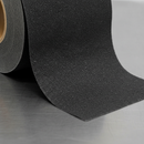 Close-up of extra coarse anti-slip tape showing larger grit particles vs standard tape