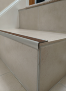 Retro-fit stainless steel stair nosing R10 with Nut Brown RAL 8007 anti-slip tread TREP-GLK