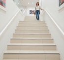 DDA anti-slip stair nosing with White PVC insert — installed on UK public building staircase, Part M compliant