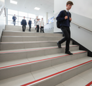 DDA anti-slip stair nosing with Red PVC insert — installed on UK public building staircase, Part M compliant