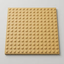 Buff GRP blister tactile paving tile, 400mm square, raised flat-topped blisters, on a grey studio background