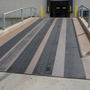 Extra coarse heavy duty anti-slip tape on heavy industrial vehicle ramp — maximum grip