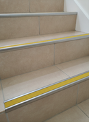 Retro-fit stainless steel stair nosing R10 with Yellow RAL 1021 anti-slip tread insert TREP-GLK