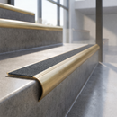 Raked back brass nosing with graphite grey grit infill