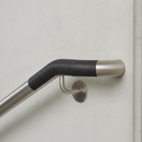 Conformable anti-slip tape wrapping around curved metal pipe surface — shows conforming capability
