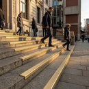 Solid brass stair nosing profile 62.8mm wide showing commercial-grade metal finish and beveled edge design
