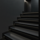 Black GRP stair nosing on contemporary UK staircase — discreet professional finish for modern interiors