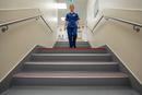 Heavy duty carpet stair nosing with Red insert — installed on UK carpeted staircase, anti-slip protection over carpet