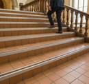 DDA anti-slip stair nosing with Brown PVC insert — installed on UK public building staircase, Part M compliant