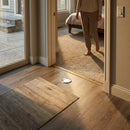 White oak stair nose with recessed LED light illuminating wooden flooring in modern home interior