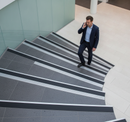 DDA anti-slip stair nosing with Black PVC insert — installed on UK public building staircase, Part M compliant