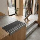 Commercial GRP stair nosing with non-slip surface installed on modern concrete steps in minimalist interior