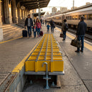 Yellow GRP platform connection grating with L-type hook design installed on train station platform