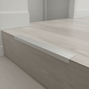 Matt Silver NAS aluminium stair nosing on light grey LVT staircase in modern UK office building