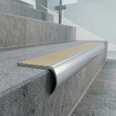 Deep 55mm bullnose of the aluminium stair nosing wrapping the front of a concrete step, castellated insert in the 70.58mm tread