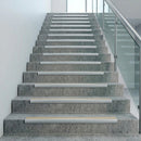 Aluminium bullnose stair nosings fitted along a full flight of commercial concrete stairs