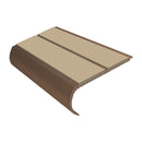 Beige anti slip bullnose stair nosing with dark bronze edge, showing curved profile and textured surface
