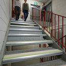 Close-up of 70x40mm anti-slip stair nosing installed on a step edge