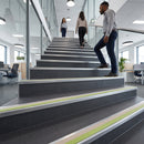 Close-up of 63x32mm aluminium stair nosing edge on an LVT step