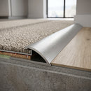 Screw fit solid brass threshold strip 15mm joining carpet to LVT flooring at a doorway