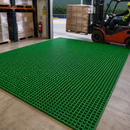 Green GRP grating floor panel in warehouse industrial setting