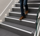 Carpet stair nosing with grey anti-slip rubber insert
