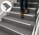 Aluminium bullnose stair nosing with grey rubber insert fitted over carpet
