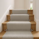 Satin nickel stair rods on modern British staircase with grey geometric runner carpet