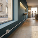 Modern stair lighting installation with CCT extension cable connecting LED strips along blue accent wall and stone steps