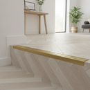 Matt Brass NAS stair nosing on herringbone LVT staircase in stylish UK new-build home