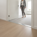 49mm wide aluminium door threshold strip installed between laminate hallway and carpet living room in modern UK home