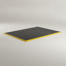 Black heavy duty anti-fatigue rubber mat with bevelled edge on a studio background, showing textured pebble surface