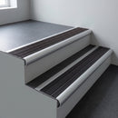Aluminium bullnose stair nosing 66.5x30mm with Black Anodised Aluminium insert fitted on an office stair