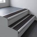 Mill aluminium bullnose stair nosing 66.5x30mm with Black Anodised Aluminium insert fitted on an office stair