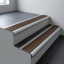 Aluminium bullnose stair nosing 66.5x30mm with Bronze Aluminium insert fitted on an office stair