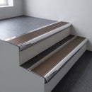 Polished aluminium bullnose stair nosing 66.5x30mm with Bronze Aluminium insert fitted on an office stair