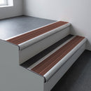 Mill aluminium bullnose stair nosing 66.5x30mm with Claret Castellated insert fitted on an office stair