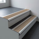 Aluminium bullnose stair nosing 66.5x30mm with Fawn Castellated insert fitted on an office stair